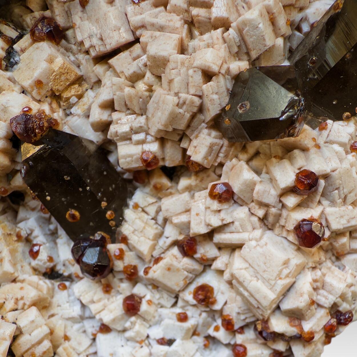 Smoky Quartz With Spessartine On Feldspar