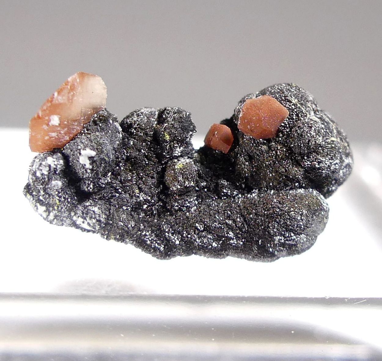 Calcite With Hematite Inclusions On Mottramite