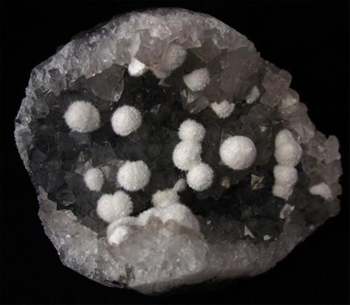 Okenite On Quartz