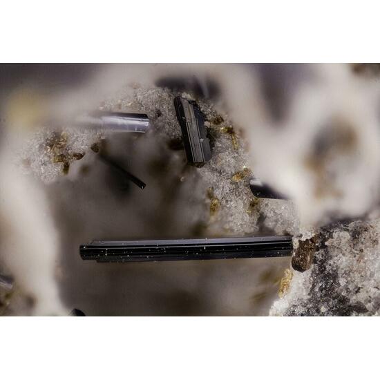 Fluoro-edenite Pseudobrookite & Hematite